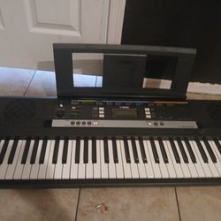 Yamaha PSR-E243 61-Key Electronic Keyboard.