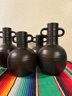 9 black vases 21aroundx 9 hight. 21around x 11 hight