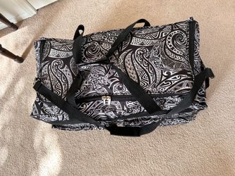 Island Spirit - new rolling duffels in black & white patterns.