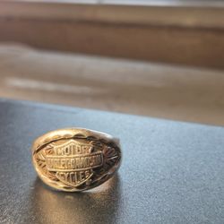 Selling a genuine Harley-Davidson ring made with 10K gold and .925 sterling silver. Solid, heavy ring with a classic biker design.