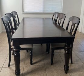 Dark wood dining table set