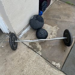 25s pair of weights  with curl bar plus 30lbs and 20lbs medicine balls /slam balls