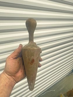 vintage wooden plumb bob (or a wooden marlinspike / fid).
