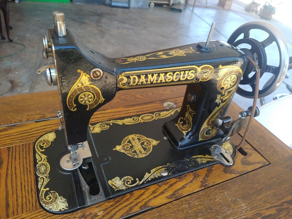 Antique Damascus Treadle Sewing Machine With Tiger Oak Cabinet Trades?