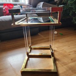 Acrylic/Lucite polished brass accents with a mirrored tabletop