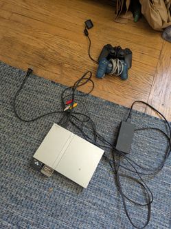 PS2 with 2 controllers, 2 memory cards, and games