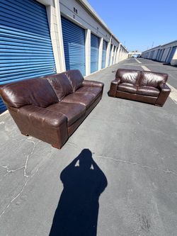 Chocolate faux leather living spaces matching couch set