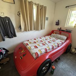 Twin size race car bed little tikes red plastic. Good condition.