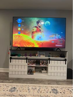 Tv stand w/ sliding doors