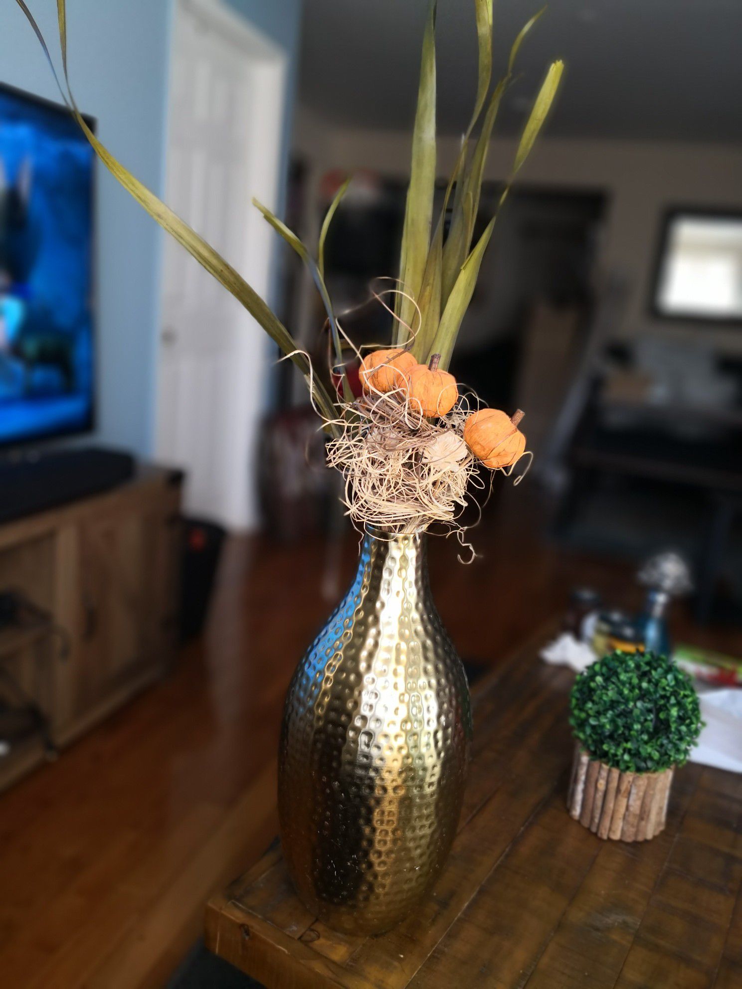 Faux pumpkin flowers with vase