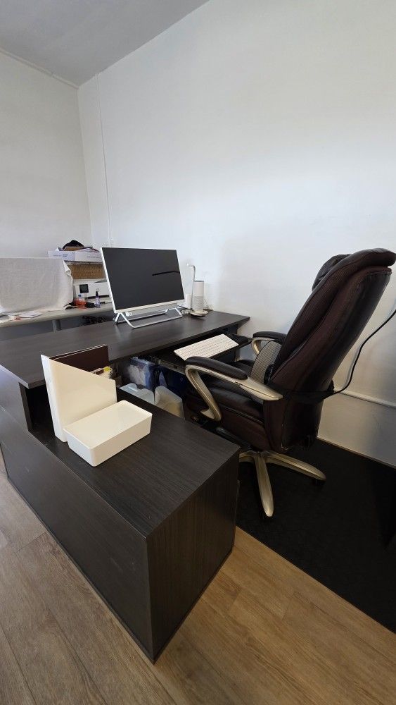 Desk with keyboard tray, shelves and filing drawer.