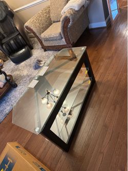 Glass fancy TV stand with blue leather chairs in good condition