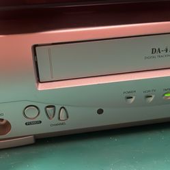 VHS PLUS DVD PLAYER AND TAPES