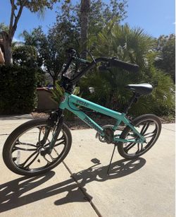 Like new Mongoose Craze 20-Inch Freestyle BMX Bike in a teal/mint blue and black
