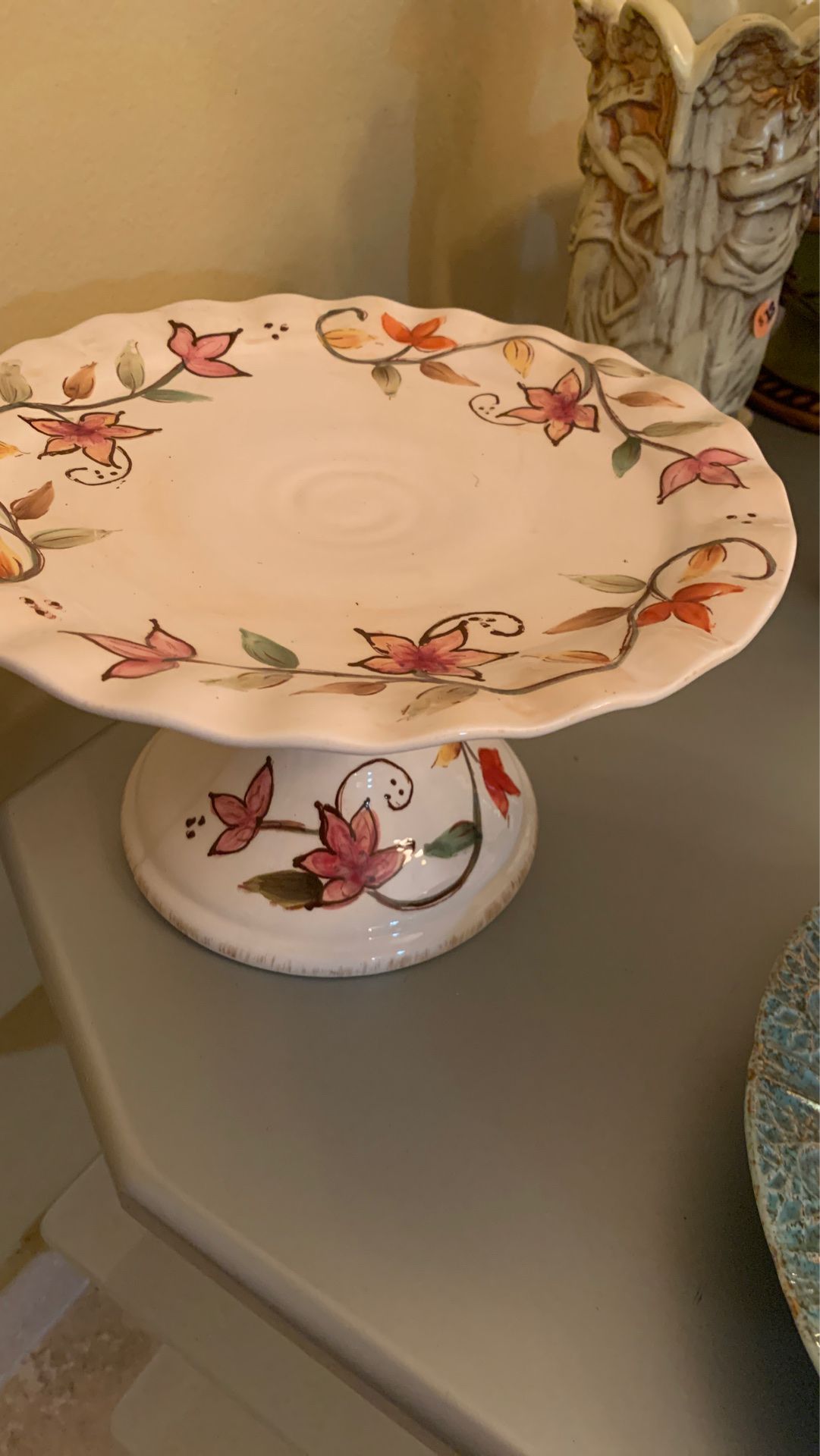 Vintage cake stand. Very strong and unique. Hand painted from England . A collectible piece
