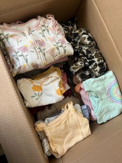 Box of baby girl clothes