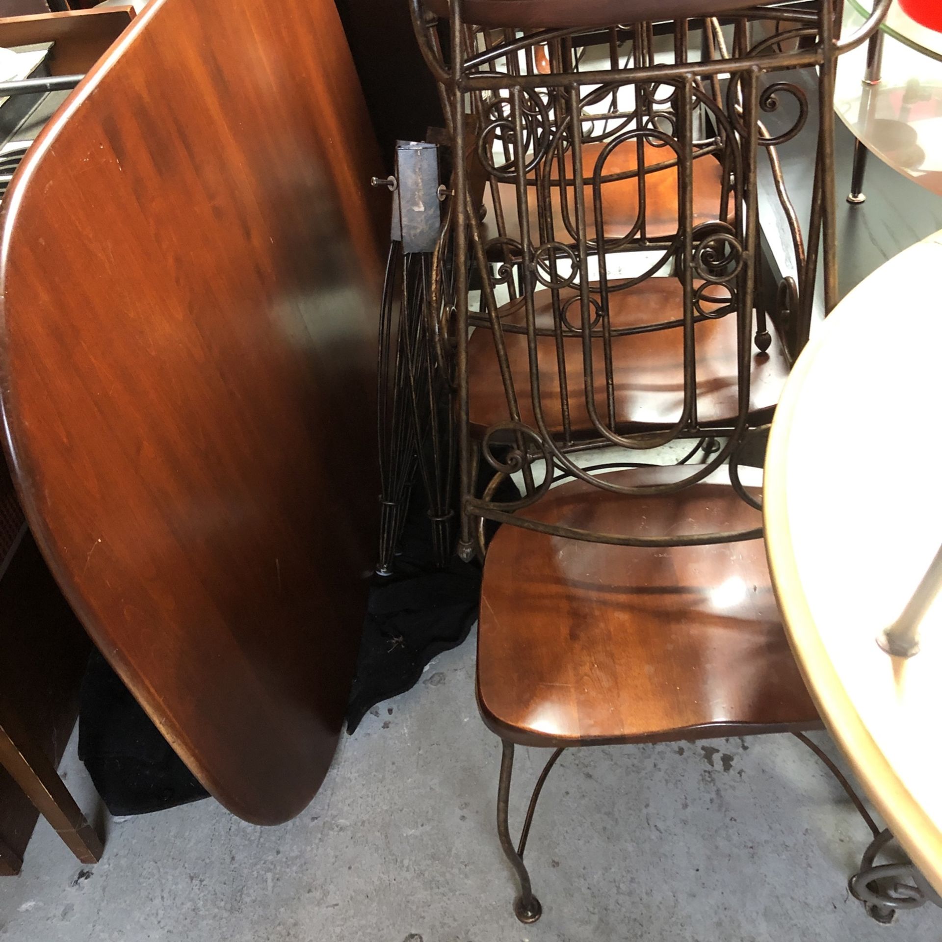 Metal and solid wood table with six chairs very strong good condition you could use it outside
