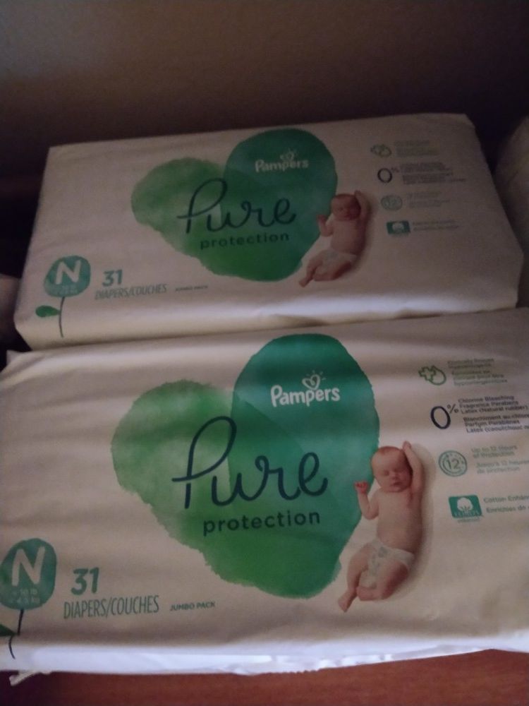 2 unopened packs of Pure pampers Newborn diapers