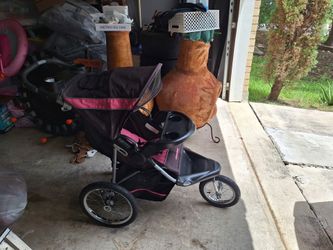 Pink walking stroller