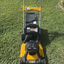 Brand new DEWALT 21 in. 2x20V MAX Cordless Battery Powered Push Lawn Mower Kit. Never used and everything is included.  This is the full kit that come