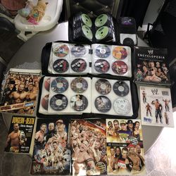 261 WWE AND TNA WCW WWF DVDS collection and 7 WWE Books programs