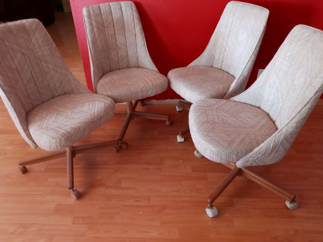 4 Vintage rolling Chairs.