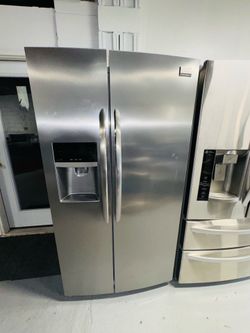 Frigidaire stainless steel refrigerator (36" x 69" x 24") with a receipt for a 90-day warranty.