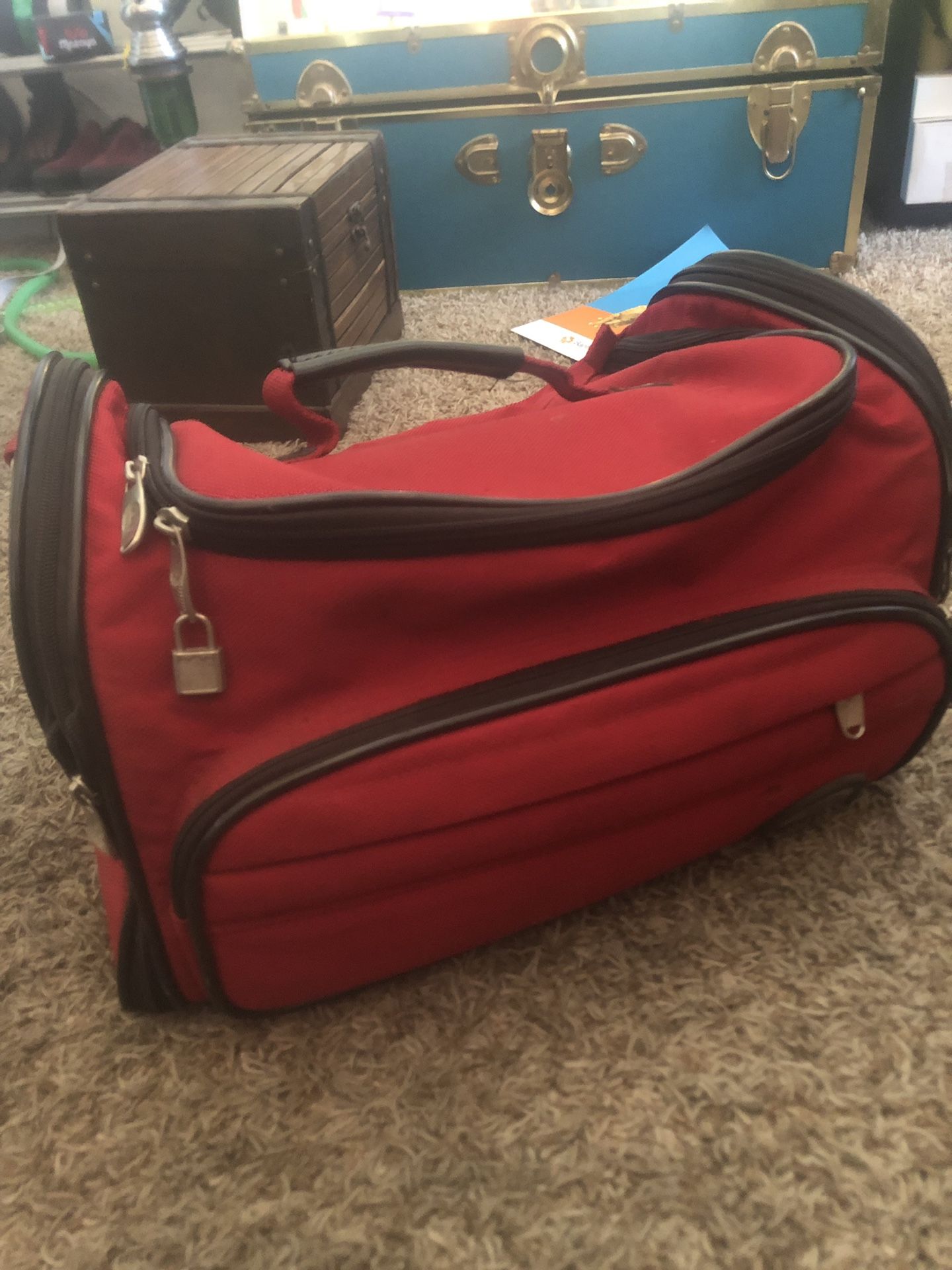 Olympia expanding red duffle bag