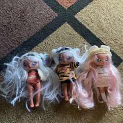 3 Like New  NA NA NA surprise Dolls. 3/25$