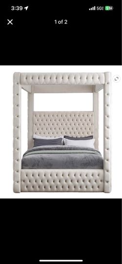 Cream canopy queen bed