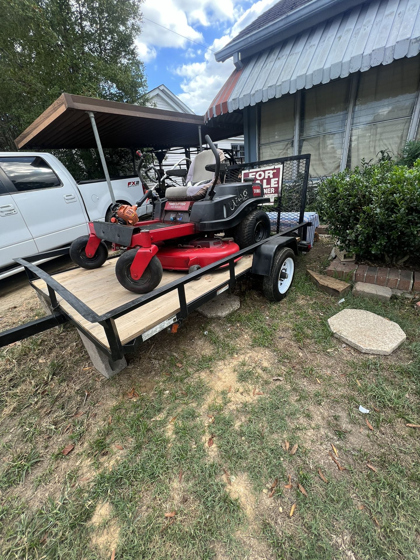Lawn Care Starter Bundle: Trailer, Zero Turn Mower, and Weedeater