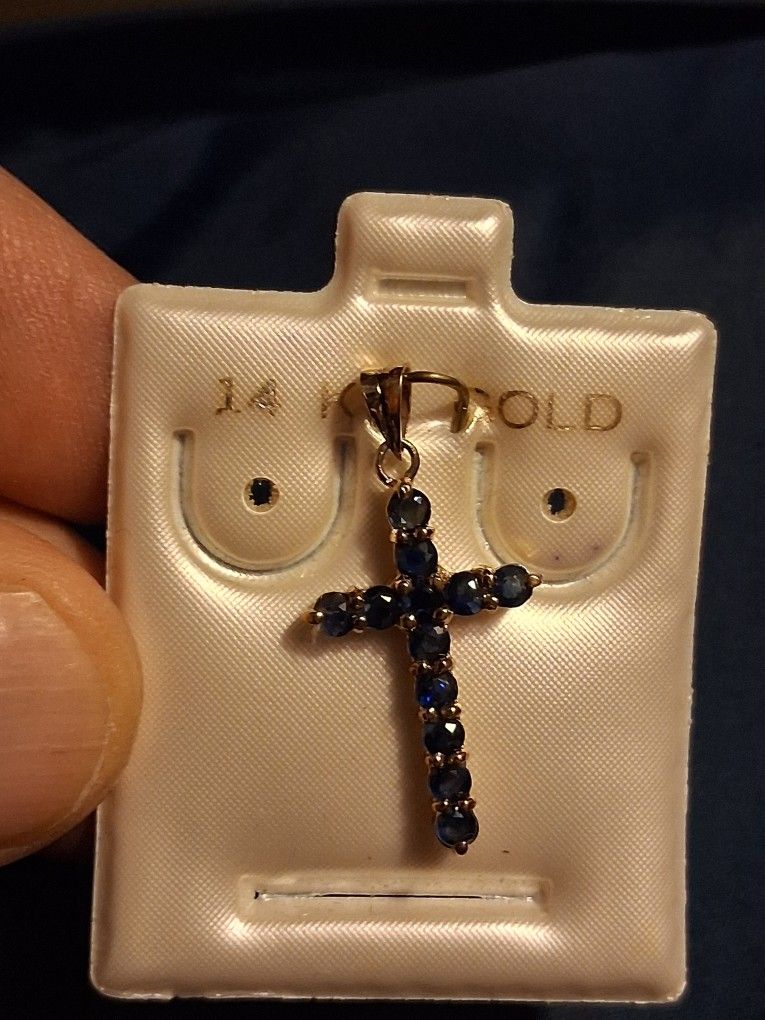14K solid gold cross pendant with gemstones.