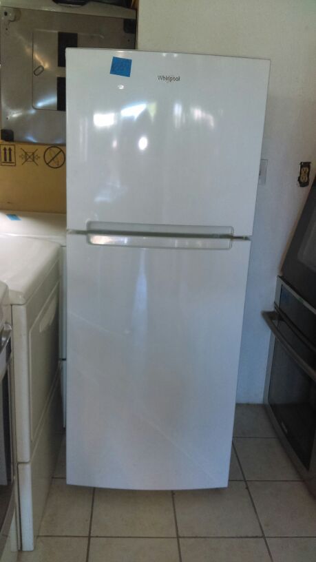 Whirlpool refrigerator White almost new 24wide by 61 1/2