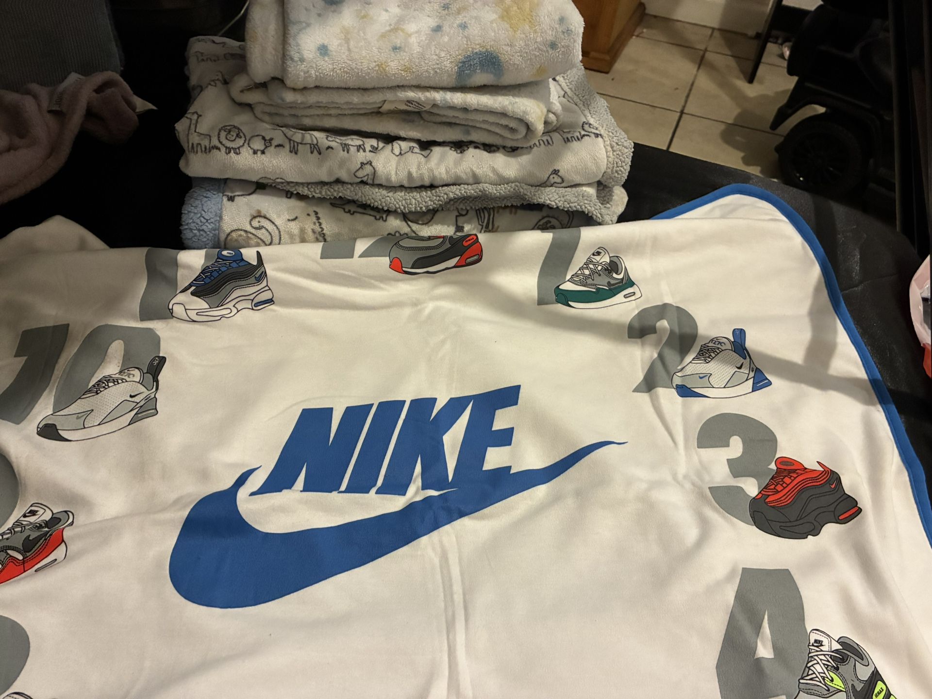 Baby shoes , clothes , blankets , diaper bag