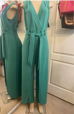 Beautiful long green jumpsuit with a leg slit. New