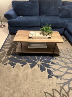 Blue Rug, Curtains, Table And Pictures