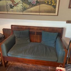 Antique bed turned settee.