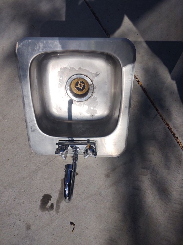 Stainless steel sink. 12x12 x 5 inches deep 17 x15 hole