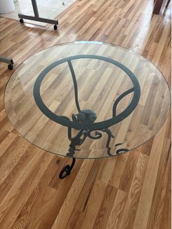 Wrought Iron and glass table.