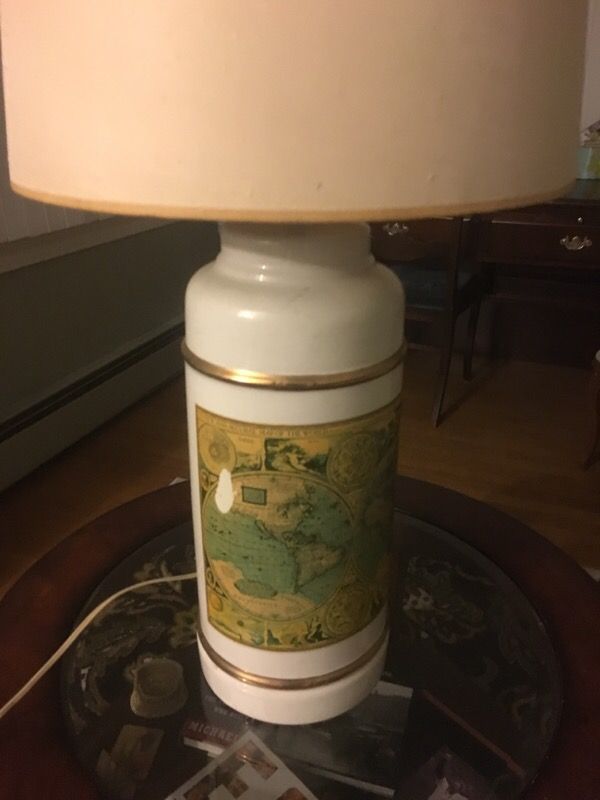 Antique lamp with map of the world