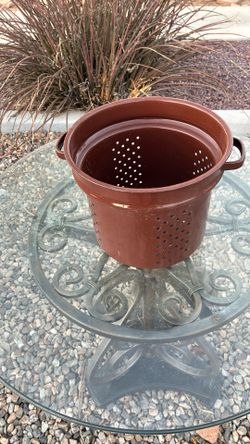 Vintage pot with holes strainer
