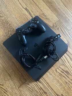 Sony PlayStation 4 Slim, one genuine-looking DualShock 4 controller, the power cable