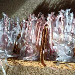 Light up Ribbon wands for party wedding holidays with fairy lights, jingle bells and ribbons attached
Baskets included for carrying wands

Condition i