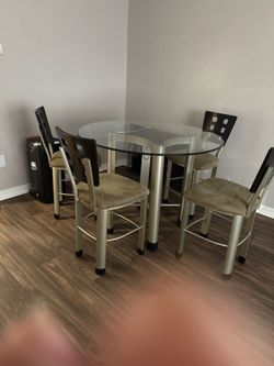 Glass dinning table the chair board need to be fix