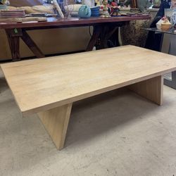 modern light wood coffee table w/ a minimalist design - 58” x 32” 