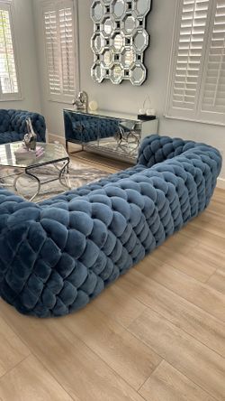 Two tufted velvet sofas