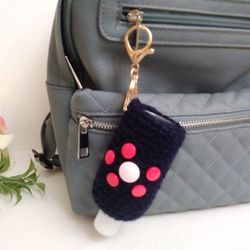 Amigurumi hand sanitizer holder. crochet hand sanitizer pouch. body lotion holder. bag charm. backpack hand sanitizer holder. gel disinfectant