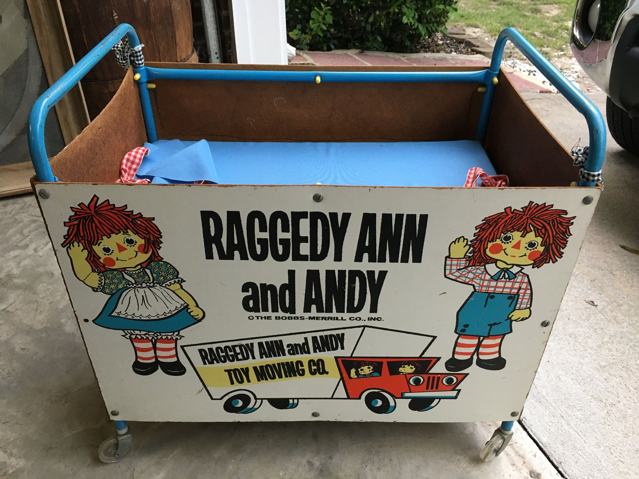 Vintage Raggedy Ann and Andy rolling toy chest on wheels