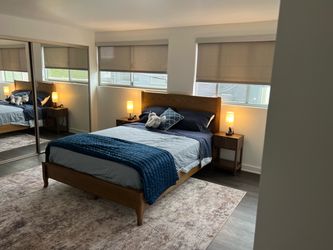 Light brown Queen bed with Mattress and optional sheets and comforter