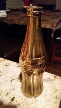 Brass Coca-Cola bottle. 8 in tall. Very heavy..